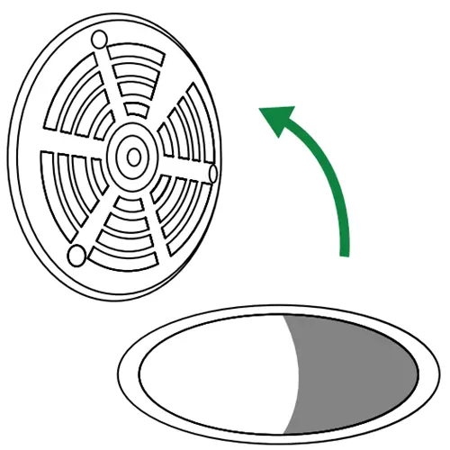 Removing the existing drain grate to expose the drain opening